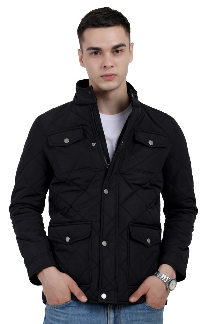 A man wearing a Black quilted jacket with a collar neck, zipper closure and pocket in hand designed for casual winter layering and comfort.