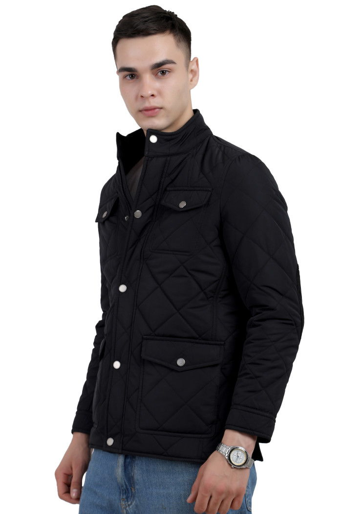 A left pose of a man wearing a Black quilted jacket with a collar neck, zipper closure and pocket in hand designed for casual winter layering and comfort.