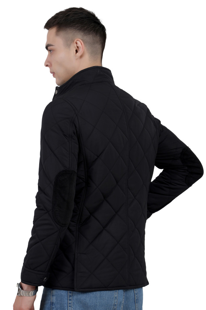 A back pose of a man wearing a Black quilted jacket with a collar neck, zipper closure and pocket in hand designed for casual winter layering and comfort.