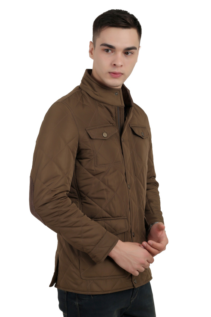 A right pose of a man wearing a Bronze quilted jacket with a collar neck, zipper closure and pocket in hand designed for casual winter layering and comfort.