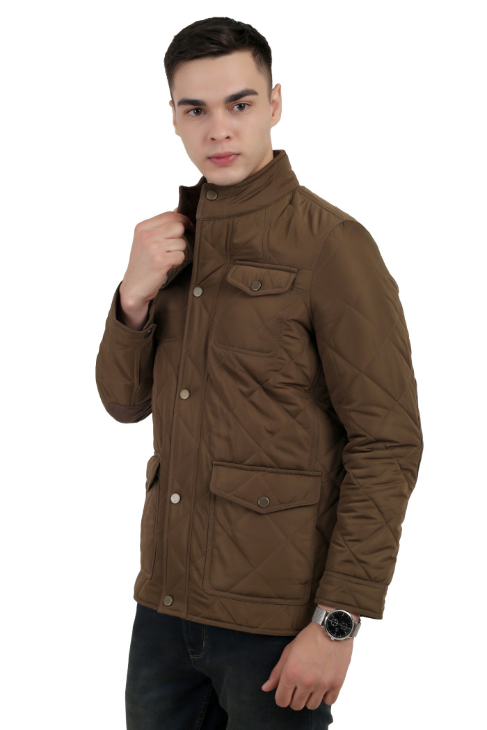 A left pose of a man wearing a Bronze quilted jacket with a collar neck, zipper closure and pocket in hand designed for casual winter layering and comfort.