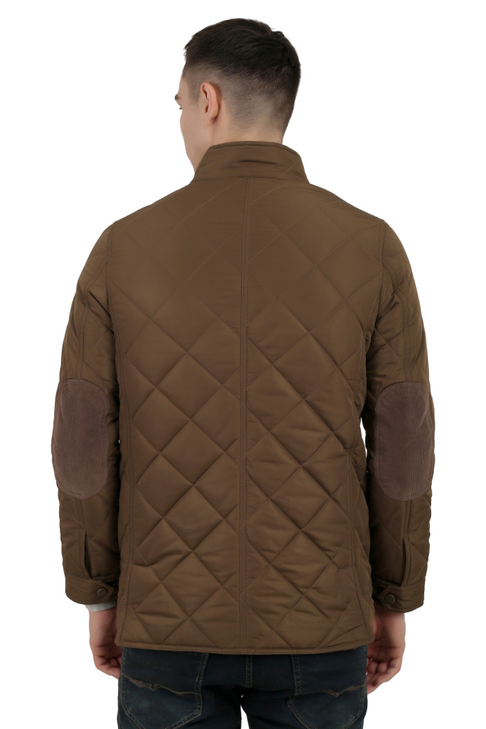 A back pose of a man wearing a Bronze quilted jacket with a collar neck, zipper closure and pocket in hand designed for casual winter layering and comfort.