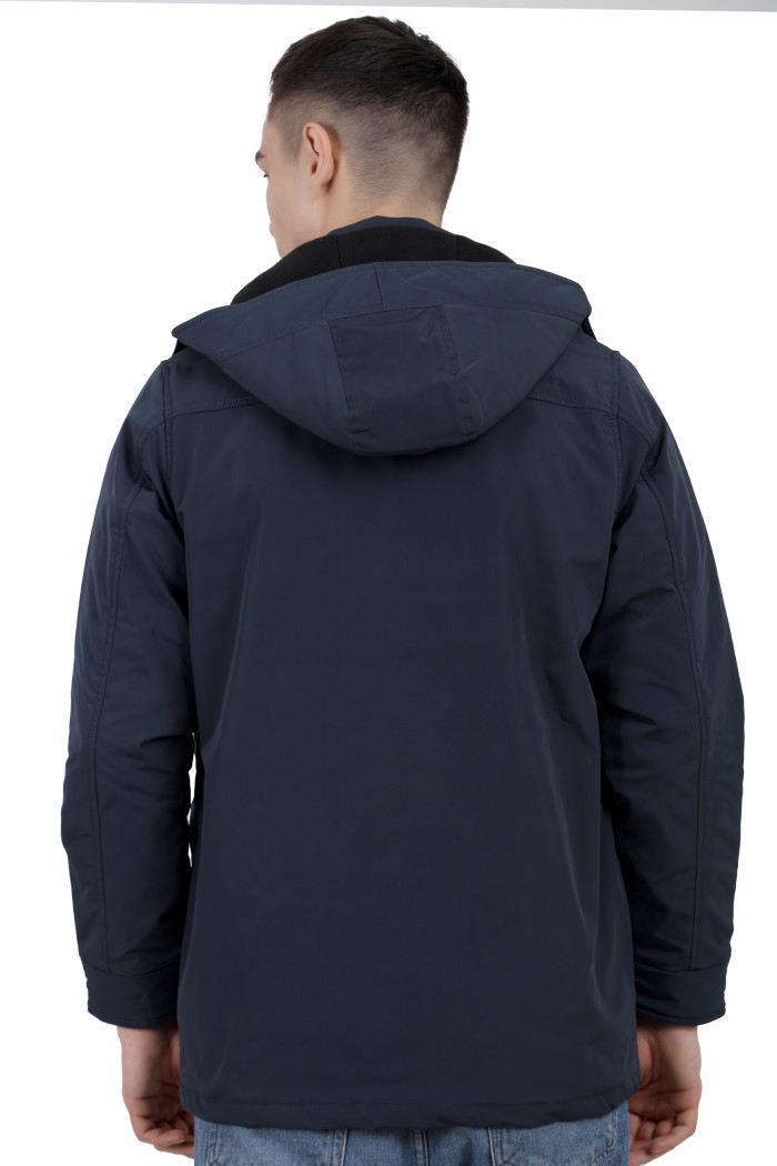 A back pose of a man wearing a Navy High Neck chester Jacket with zipper closure Button Placket, and pocket in hand designed for casual winter layering and comfort.