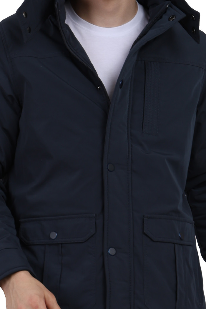 A cropped image of a man wearing a Navy High Neck chester Jacket with zipper closure Button Placket, and pocket in hand designed for casual winter layering and comfort.