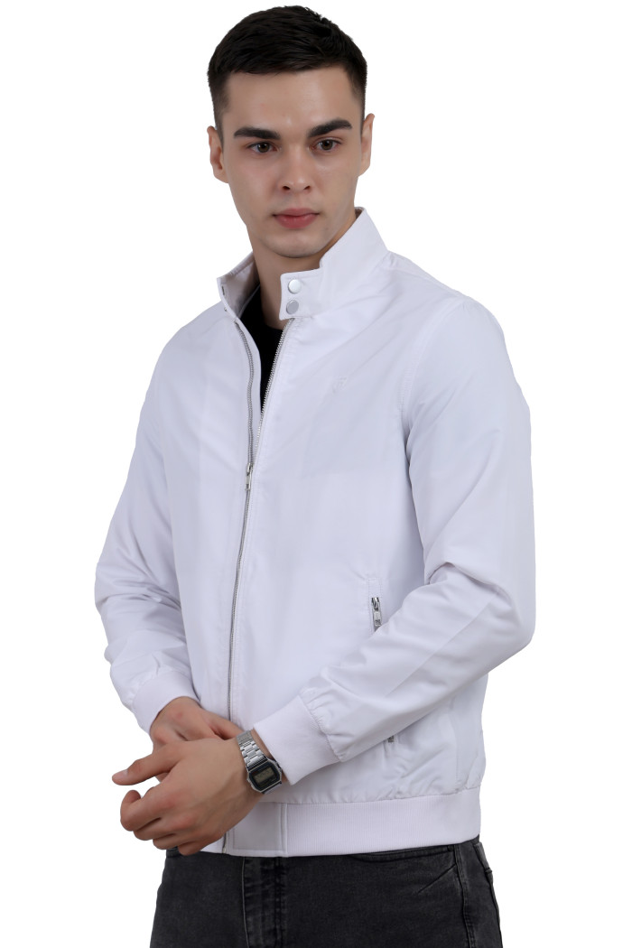 A left pose of a man wearing a White Matt Finish Lightweight Jacket with high neck collar, zipper closure and pocket in hand designed for casual winter layering and comfort.