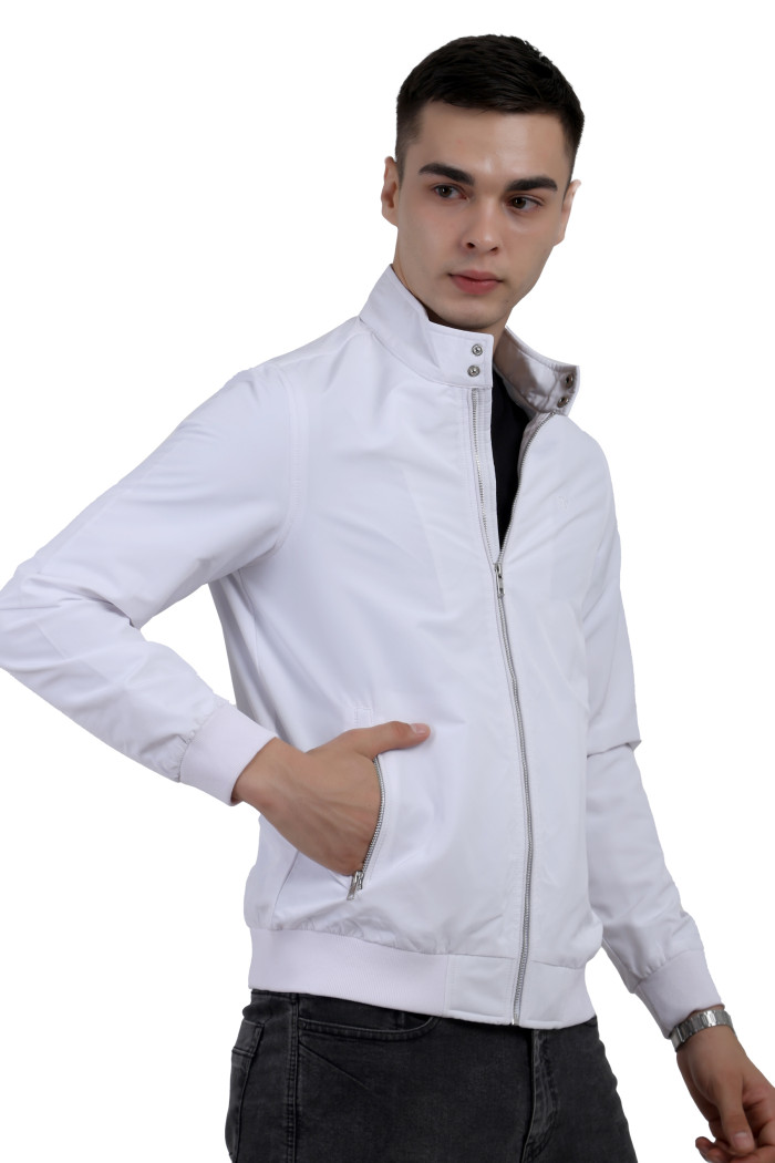 A right pose of a man wearing a White Matt Finish Lightweight Jacket with high neck collar, zipper closure and pocket in hand designed for casual winter layering and comfort.