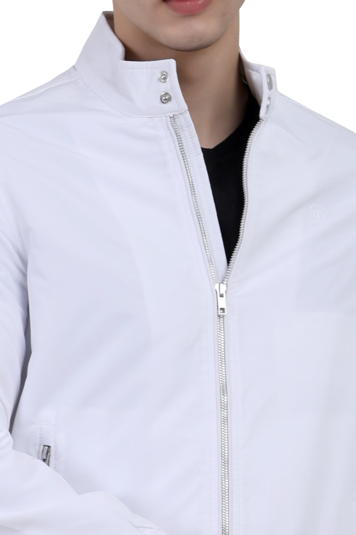 A cropped image of a man wearing a White Matt Finish Lightweight Jacket with high neck collar, zipper closure, and pocket in hand designed for casual winter layering and comfort.