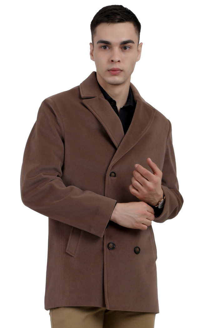 A man wearing a Mouse Double double-breasted knee Length Velvet Coat with a Lapel collar neck, Button closure and pocket in hand designed for casual winter layering and comfort.