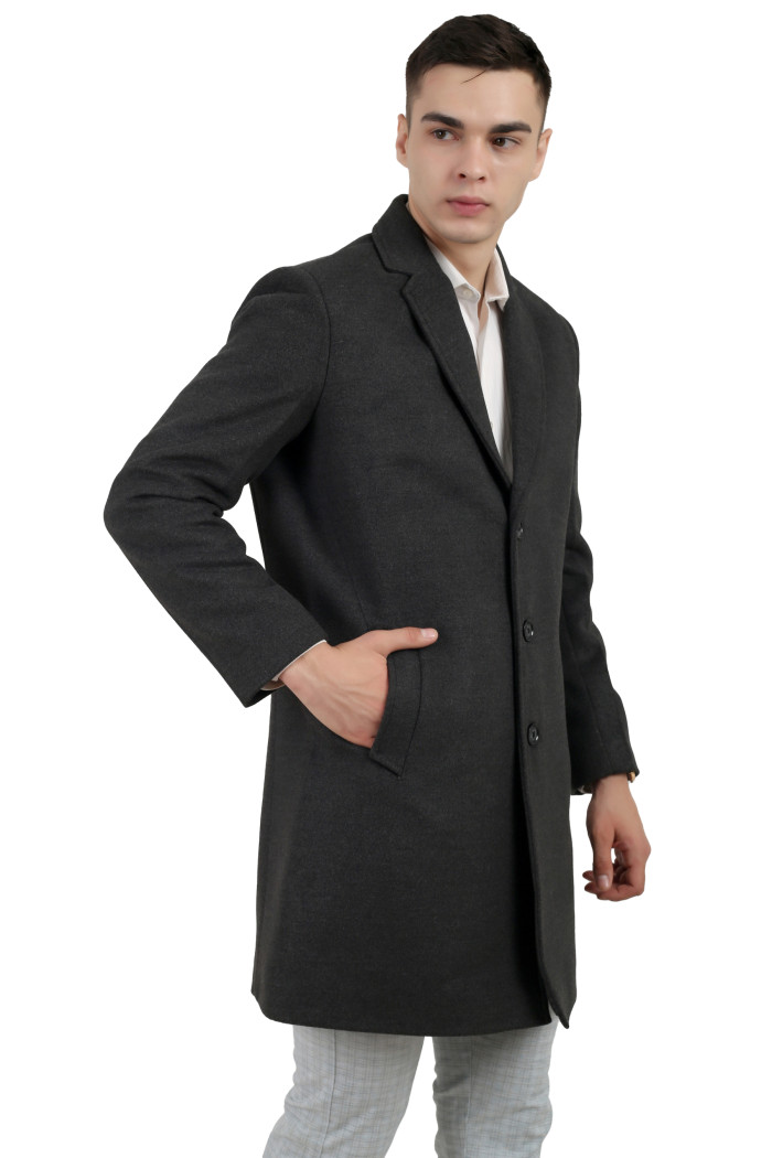 A left pose of a man wearing an Anthra Single Breasted Tweed Long Coat with a Lapel collar neck, Button closure and pocket in hand designed for casual winter layering and comfort.