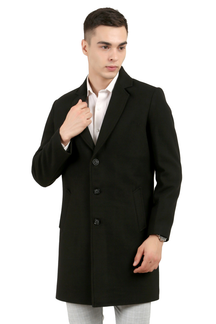 A man wearing a Black Single Breasted Tweed Long Coat with a Lapel collar neck, Button closure and pocket in hand designed for casual winter layering and comfort.