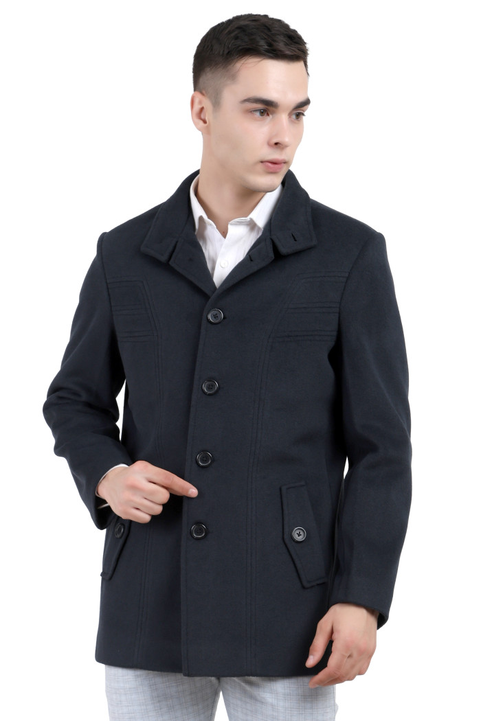 A man wearing an Charcoal Single Breasted Knee Length Tweed Coat with a Lapel collar neck, Button closure and pocket in hand designed for casual winter layering and comfort.