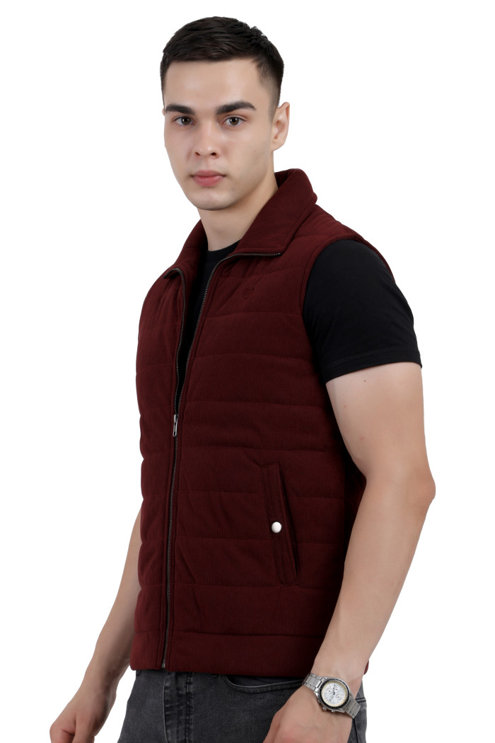 A right pose of a man wearing a Maroon half jacket with a high neck, zipper closure and side pocket designed for casual winter layering and comfort.