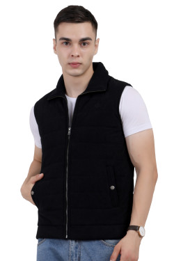 A man wearing a Black half jacket with a high neck, zipper closure and pocket in hand designed for casual winter layering and comfort.