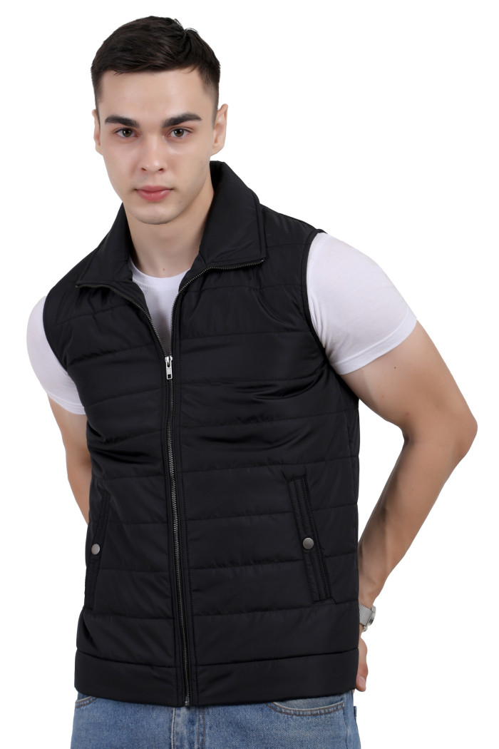 A man wearing a Black half jacket with a high neck, zipper closure and pocket in hand designed for casual winter layering and comfort.