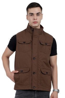 A man wearing a Brown half jacket with a high neck, zipper closure and pocket in hand designed for casual winter layering and comfort.