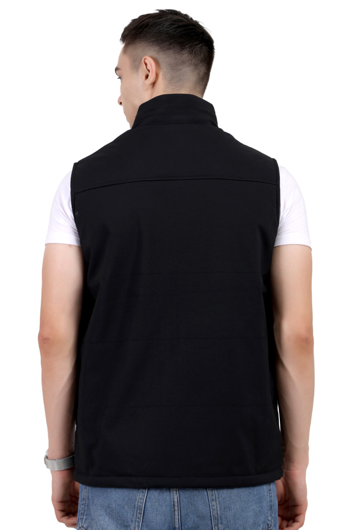 A back pose of a man wearing a Black half jacket with a high neck ,zipper closure and pocket designed for casual winter layering and comfort.