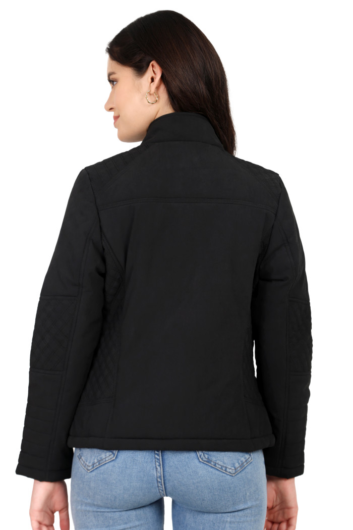 A back pose of a standing woman wearing Trufit’s black quilted biker jacket in a textured pattern.