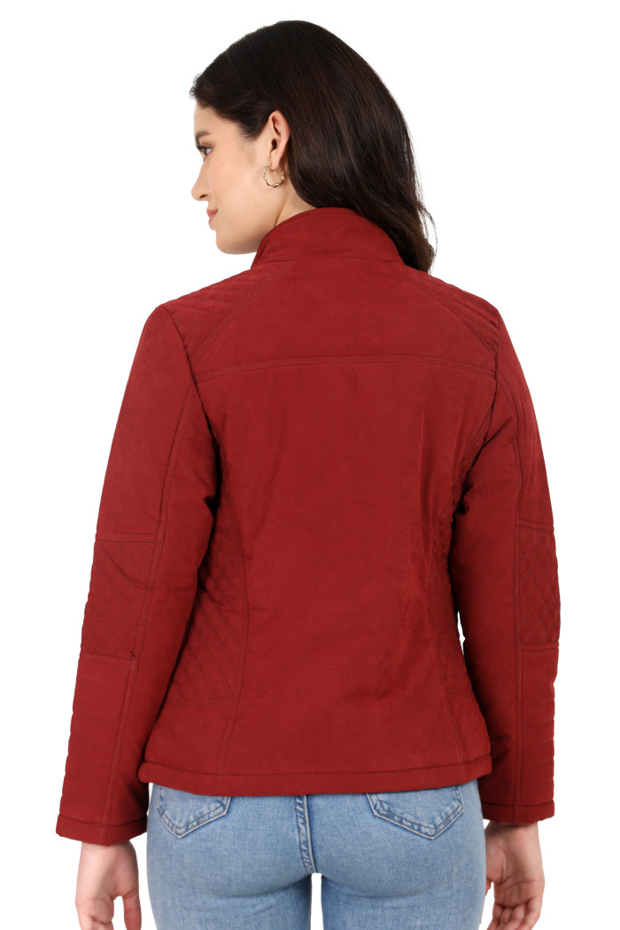 A back pose of a standing woman wearing Trufit’s maroon quilted biker jacket in a textured pattern.