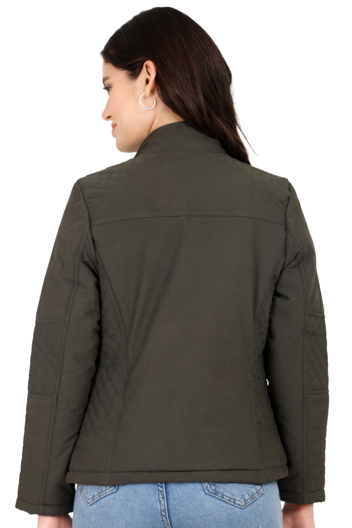 A back pose of a standing woman wearing Trufit’s olive quilted biker jacket in a textured pattern.