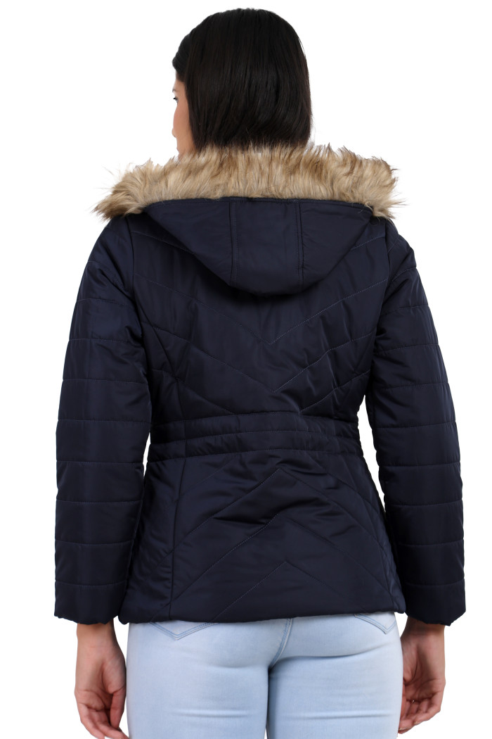 A back pose of a standing woman, wearing Coatsnmore’s coatsnmore’s casual jacket in navy colour with a textured pattern, a removable hood and blue jeans.