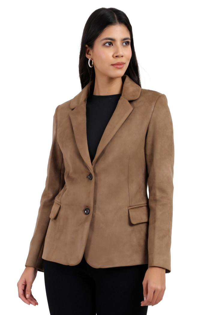 A standing pose of a woman wearing Trufit’s short-length coat in olive with a lapel collar, side pockets, and a button closure in one piece.