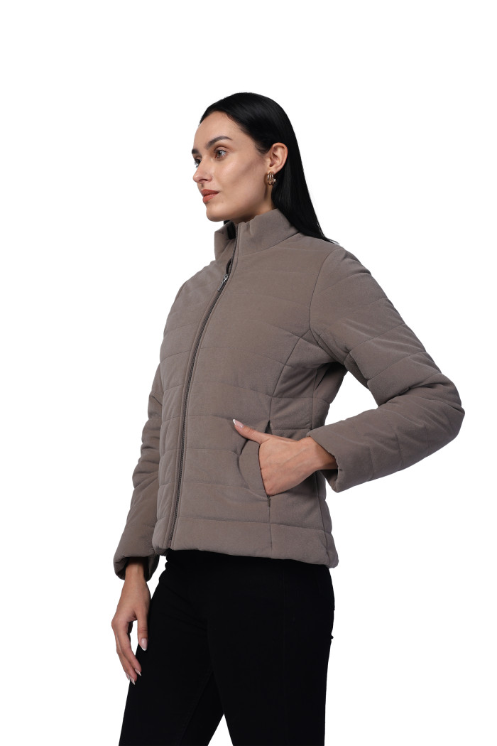A model showcasing Women Quilted Jacket In Velvet Fabric With Concealed Zipper Pocket thumbnail.