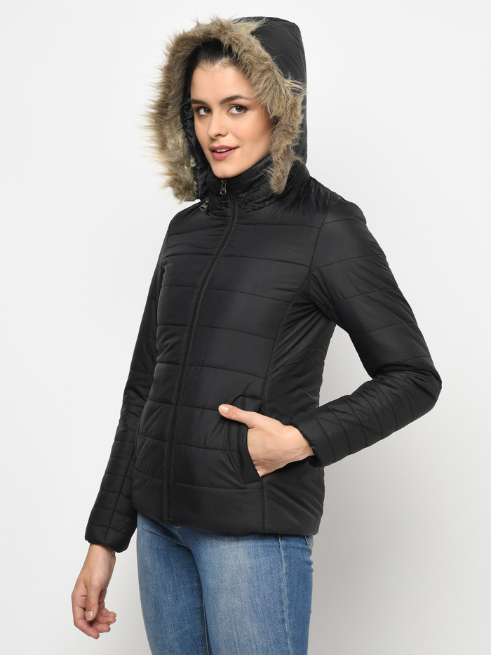 A right pose of a woman wearing a Black Puffer jacket with a high neck, hood, zipper closure and side pocket designed for casual winter layering and comfort.