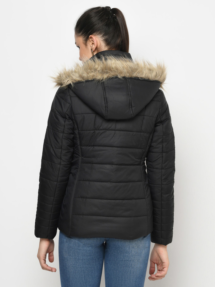 A back pose of a woman wearing a Black Puffer jacket with a high neck, and matching hood designed for casual winter layering and comfort.