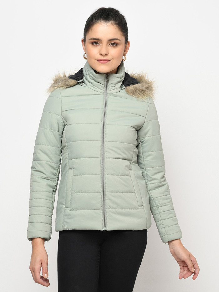 A cropped image of a woman wearing a Mint Green Puffer jacket with a high neck, and matching hood designed for casual winter layering and comfort.