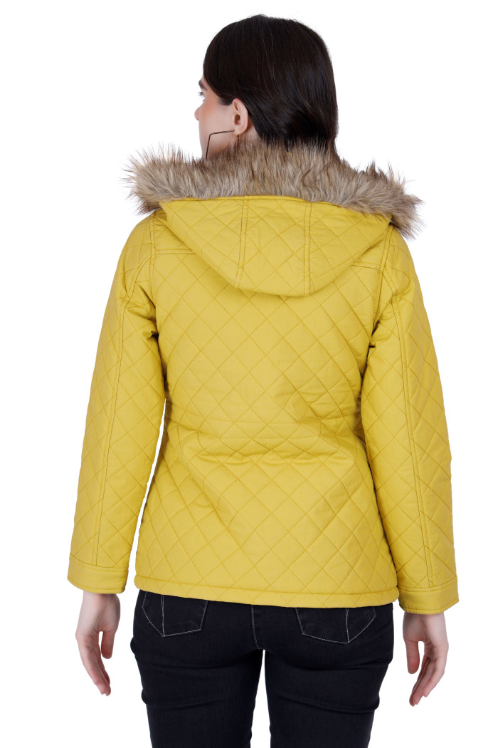 A back pose of a woman wearing a Mustard Quilted Jacket with a high neck, and matching hood designed for casual winter layering and comfort.