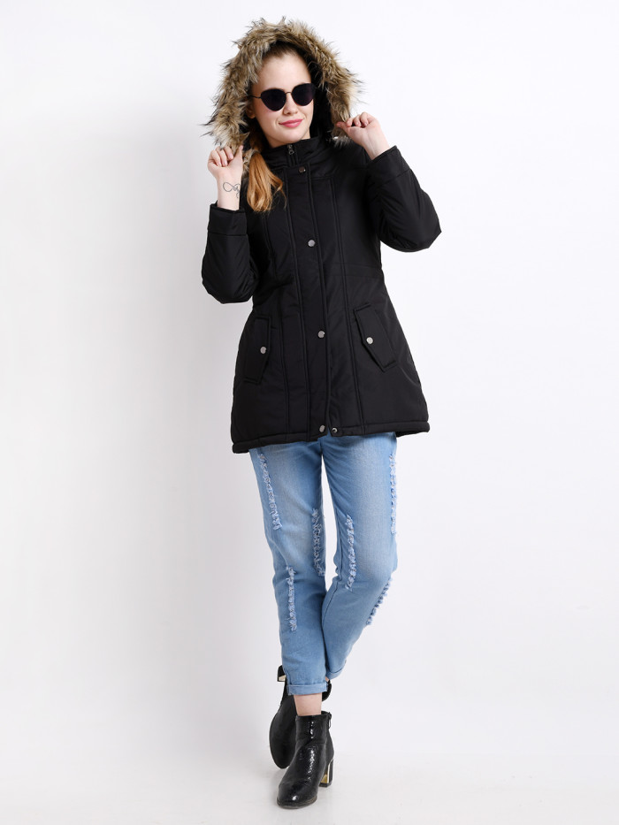 A woman wearing a Black Puffer jacket with a high neck, hood, zipper closure and pocket in hand designed for casual winter layering and comfort.