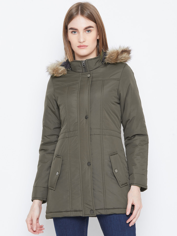 A cropped image of a woman wearing an olive Puffer jacket with a high neck, and matching hood designed for casual winter layering and comfort.