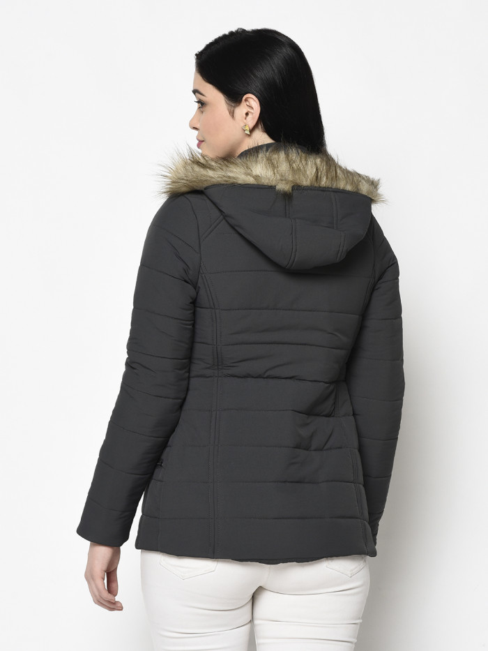 A back pose of a woman wearing a Dark Grey Puffer jacket with a high neck, and matching hood designed for casual winter layering and comfort.