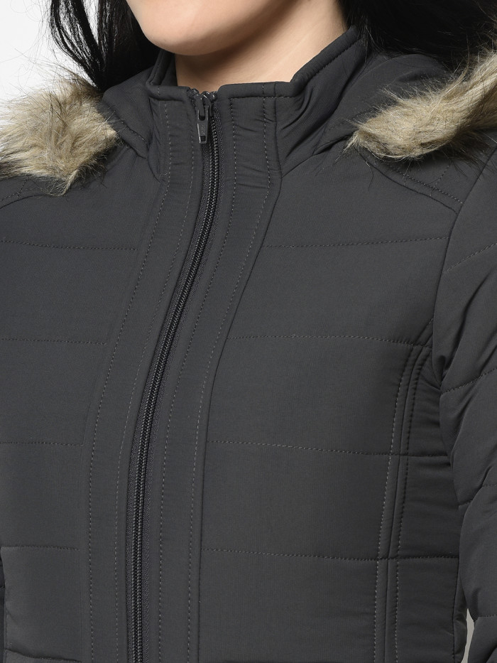 A cropped image of a woman wearing a Dark Grey Puffer jacket with a high neck, and matching hood designed for casual winter layering and comfort.