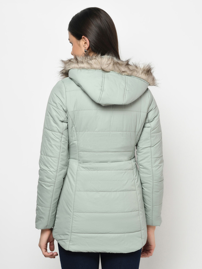 A back pose of a woman wearing a Mint Green Puffer jacket with a high neck, and matching hood designed for casual winter layering and comfort.