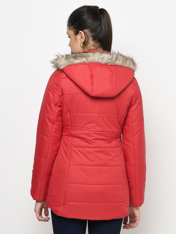 A back pose of a woman wearing a Red Puffer jacket with a high neck, and matching hood designed for casual winter layering and comfort.