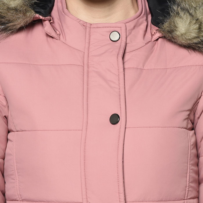 A cropped image of a woman wearing a Light Pink Puffer jacket with a high neck, and matching hood designed for casual winter layering and comfort.