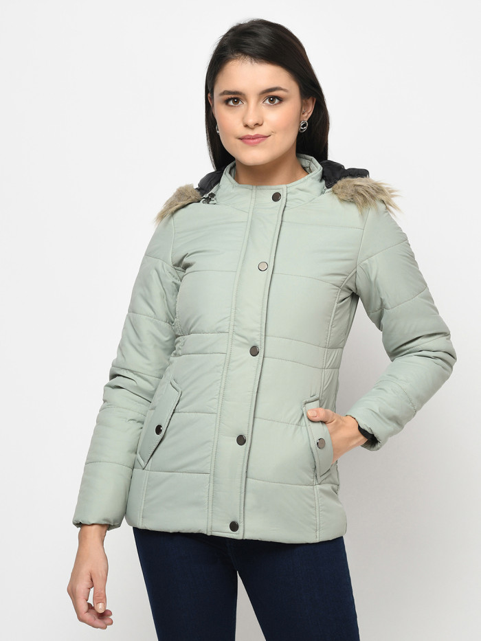 A cropped image of a woman wearing a Mint Green Puffer jacket with a high neck, and matching hood designed for casual winter layering and comfort.