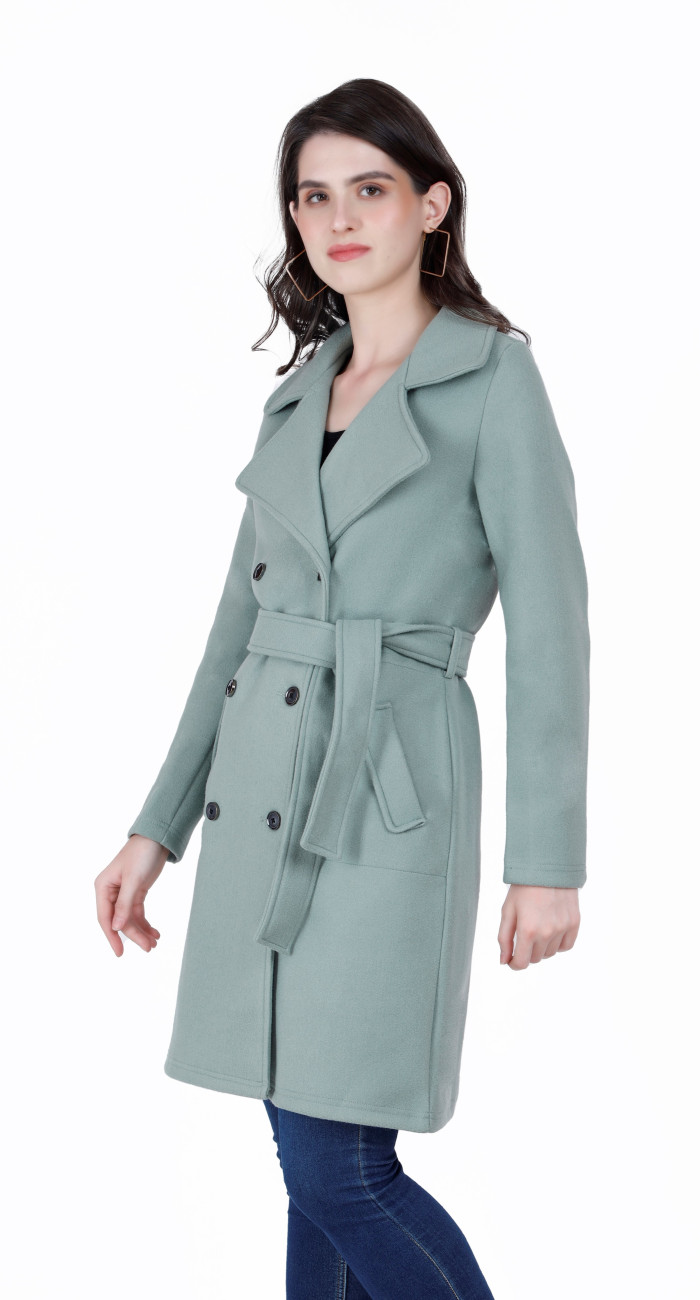 A right pose of a woman wearing a Pista Long Coat with lapel collar, belt, button closure and side pocket designed for casual and formal winter layering and comfort.