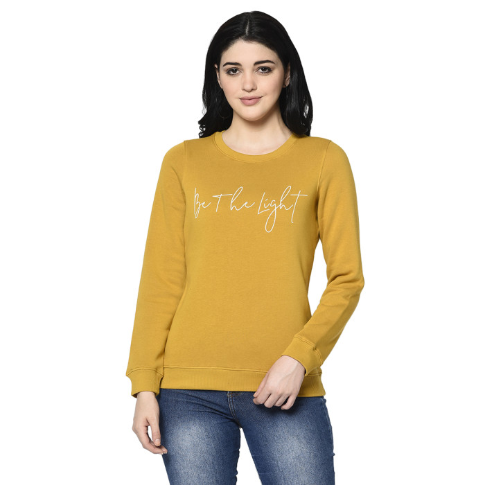 A cropped image of a woman wearing a Mustard Sweatshirt with round neck and ribbed cuff designed for mild winter.