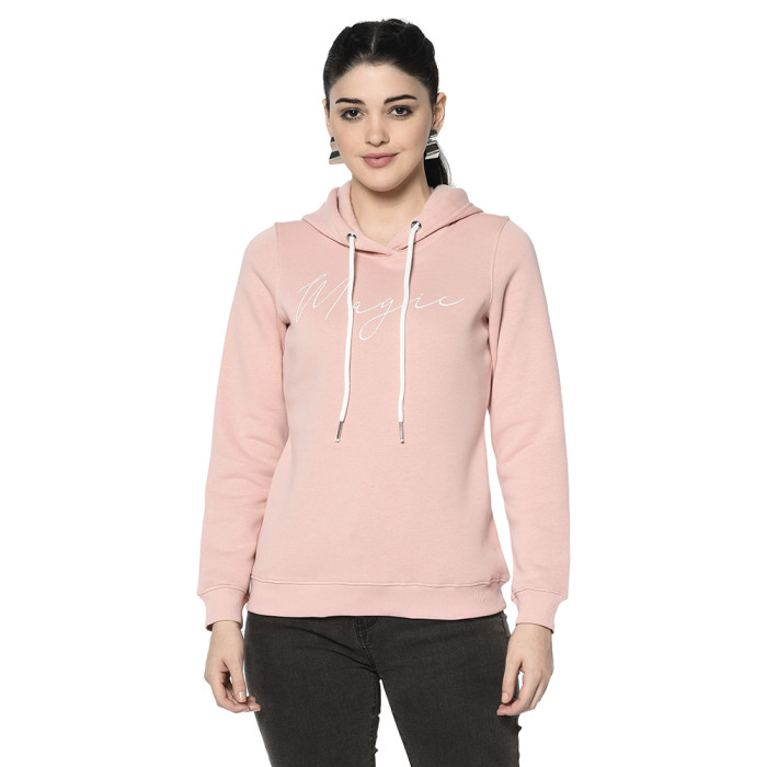 A woman wearing a Lt. Pink Hoodie with ribbed cuff, drawstring and pocket in hand designed for mild winter.