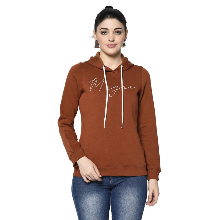 A woman wearing a Rust Hoodie with ribbed cuff, drawstring and pocket in hand designed for mild winter.